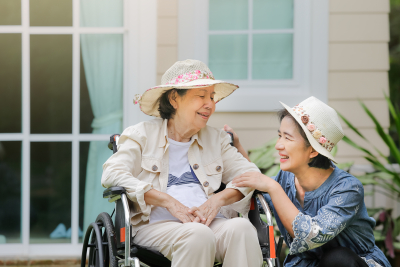 caregiver and her patient laughing